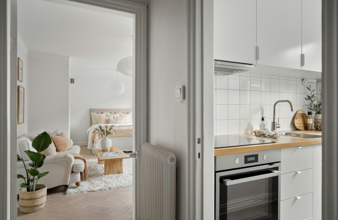 soft scandi apartment with cream living room and peach bedroom rental space